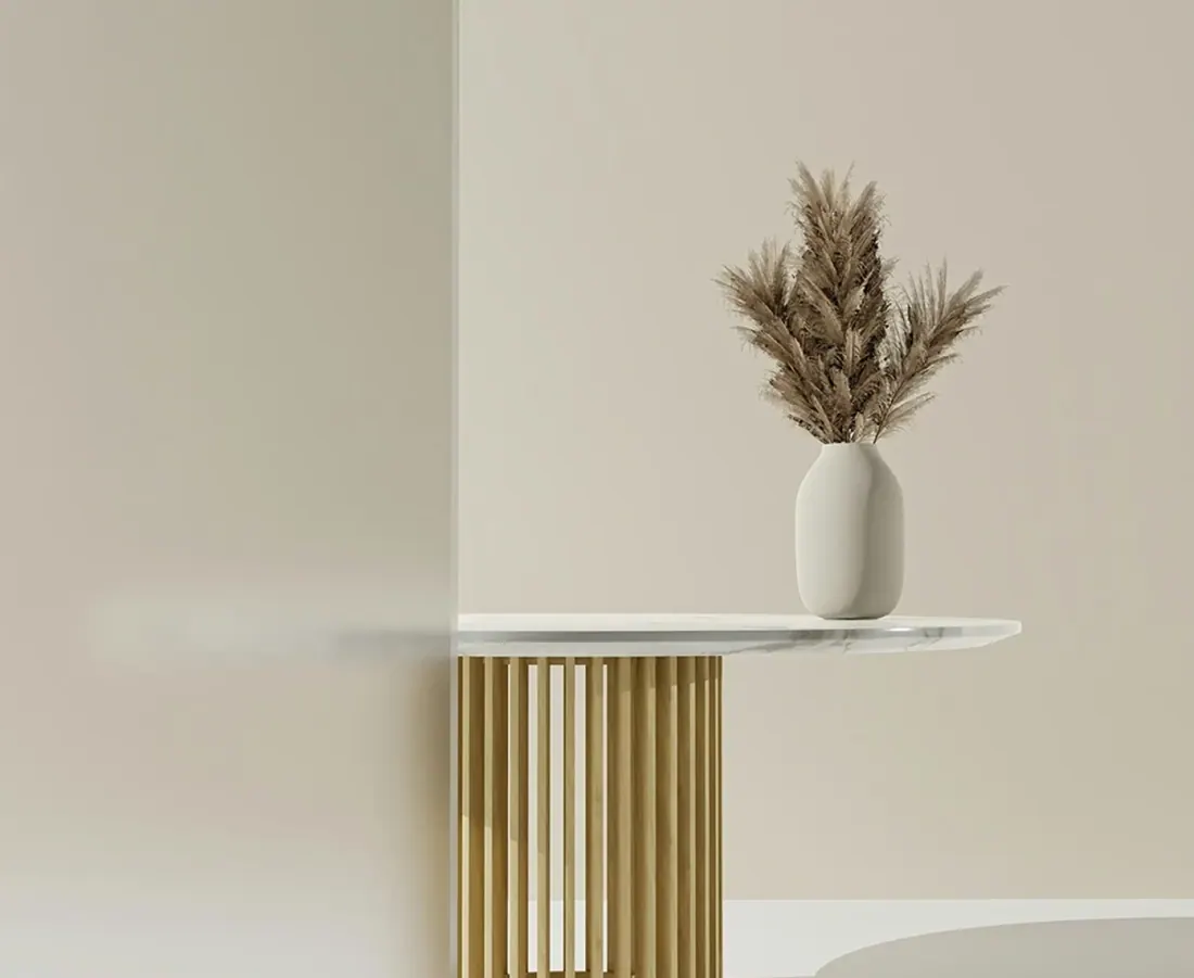 Sculptural side table with dried arrangement